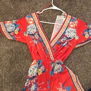 ORANGE PRINT PLUNGING NECK JUMPSUIT